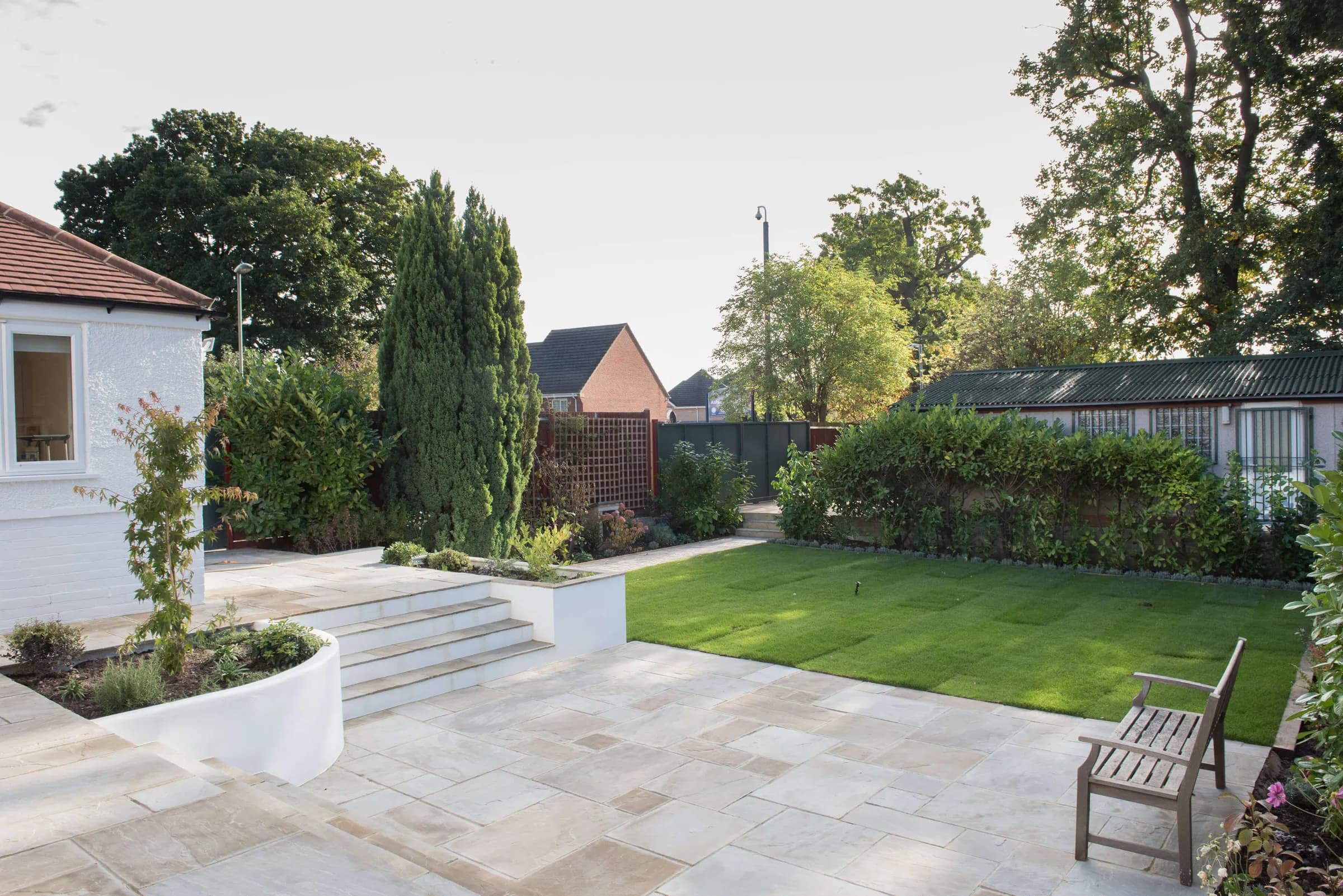 Rear elevation with rear dormer, bay window and single-storey extension opening onto a terrace