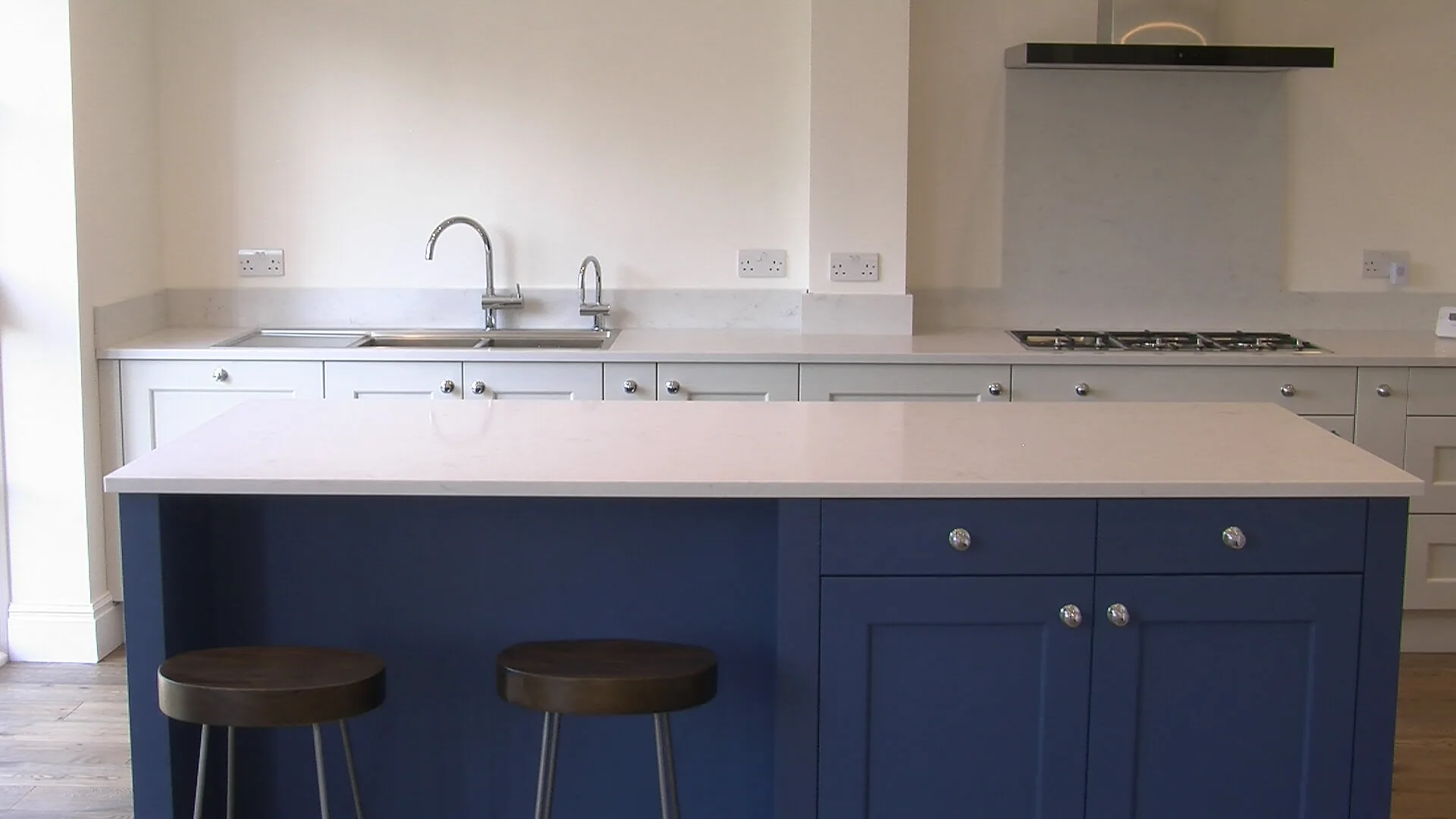 Blue shaker kitchen island at the Hill Crescent whole-house refurbishment in Totteridge
