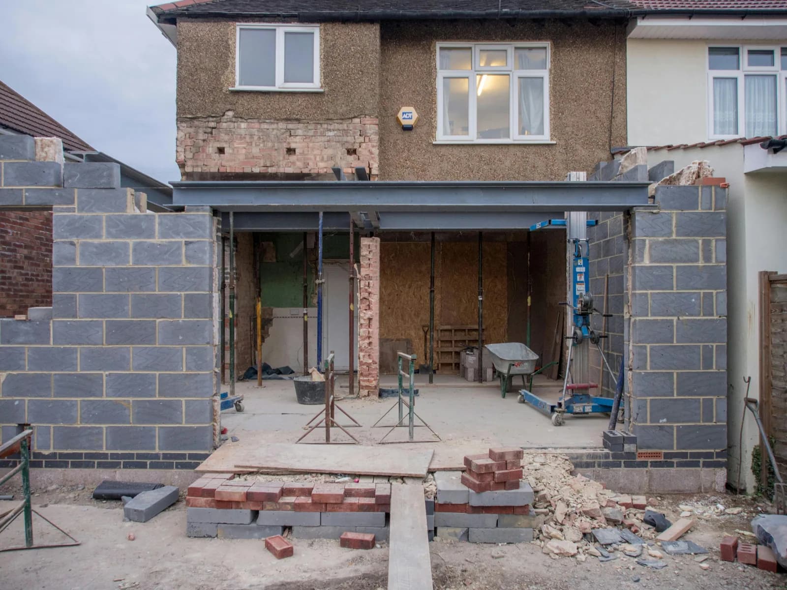 Rear extension under construction on a 1930s semi: steel beam and blockwork in place
